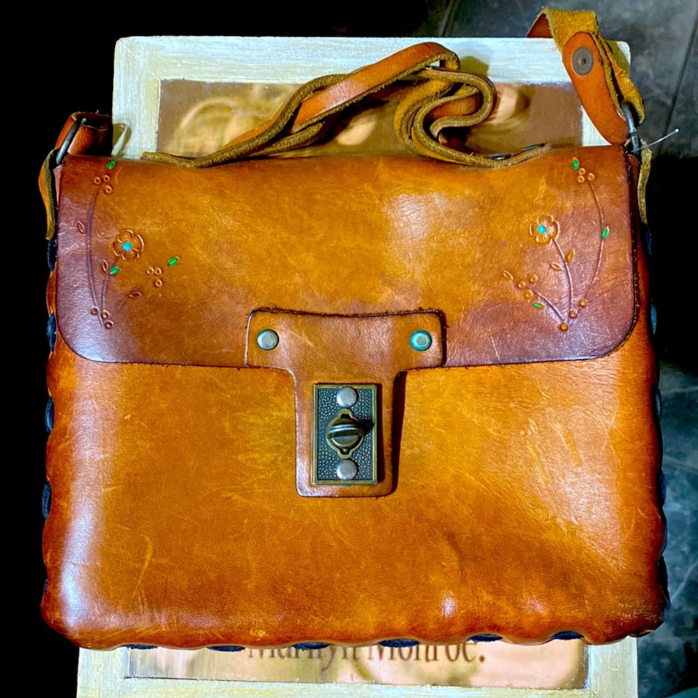 1970’s tooled leather, purse. Hand tooled Made of genuine leather.